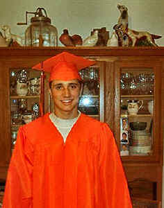 Trying on the graduation gown.  Joe is Salutatorium of the class.